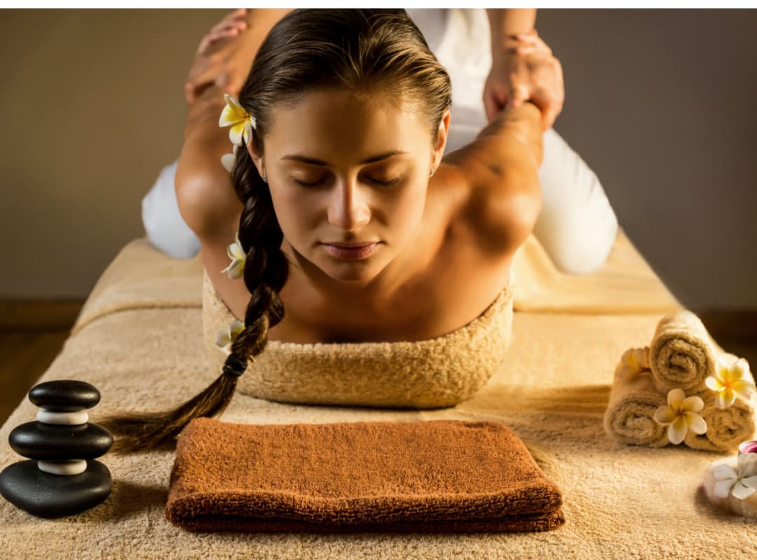 Woman receiving Thai massage